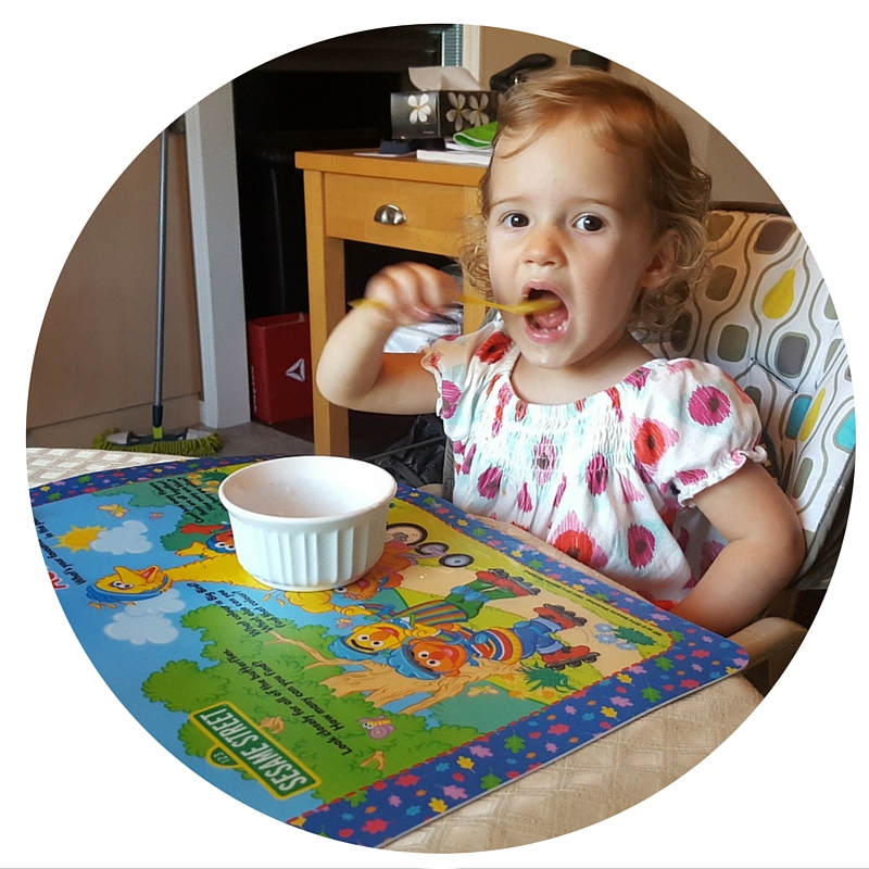 Toddler eating by herself