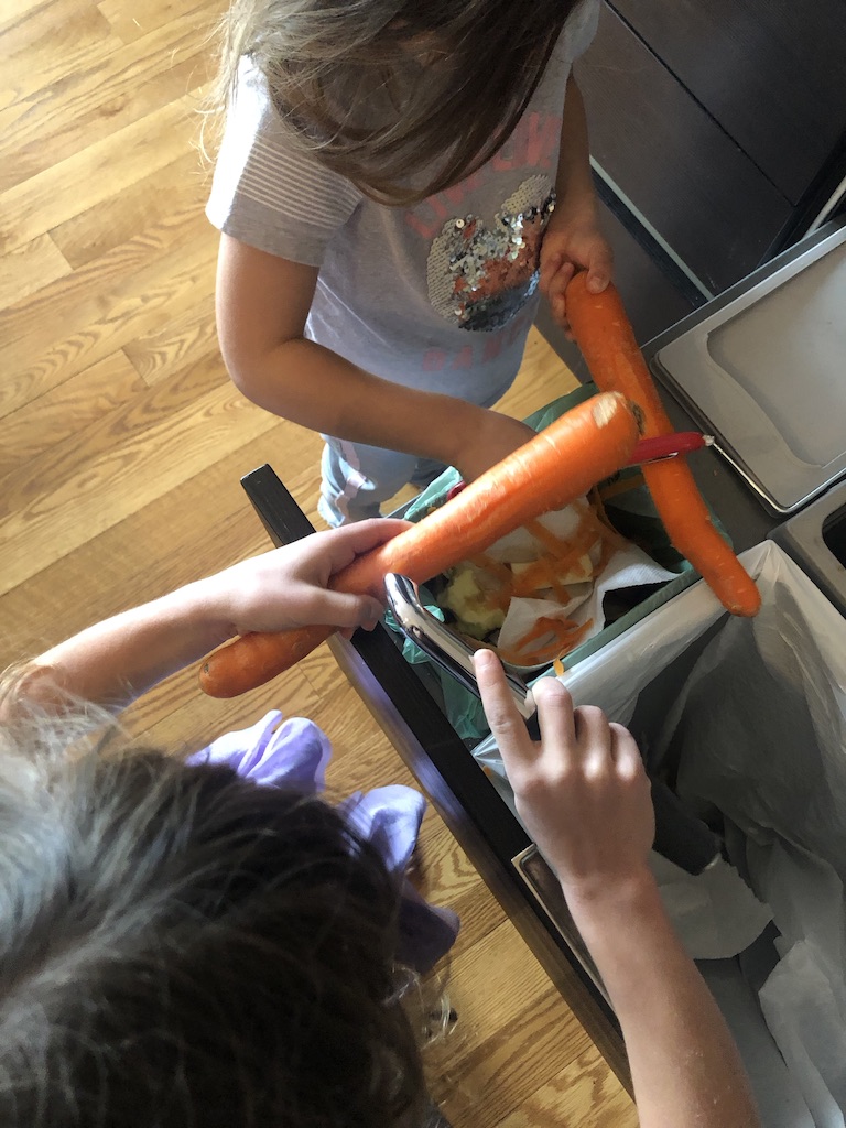 kids peeling carrots