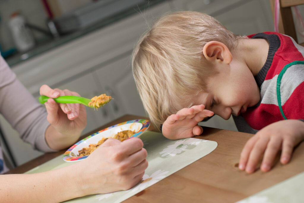 food neophobia - little boy refusing a new food