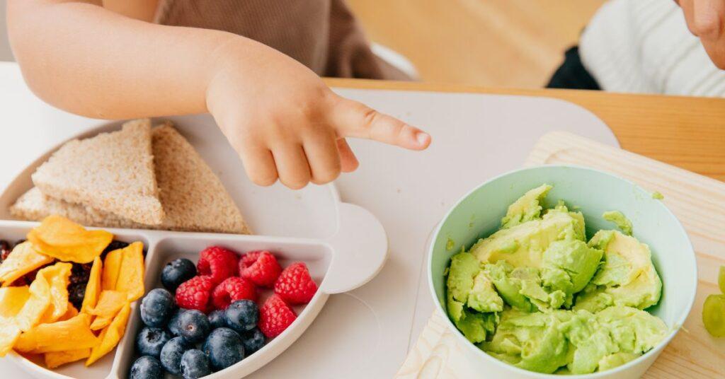 Child being offered choices for breakfast